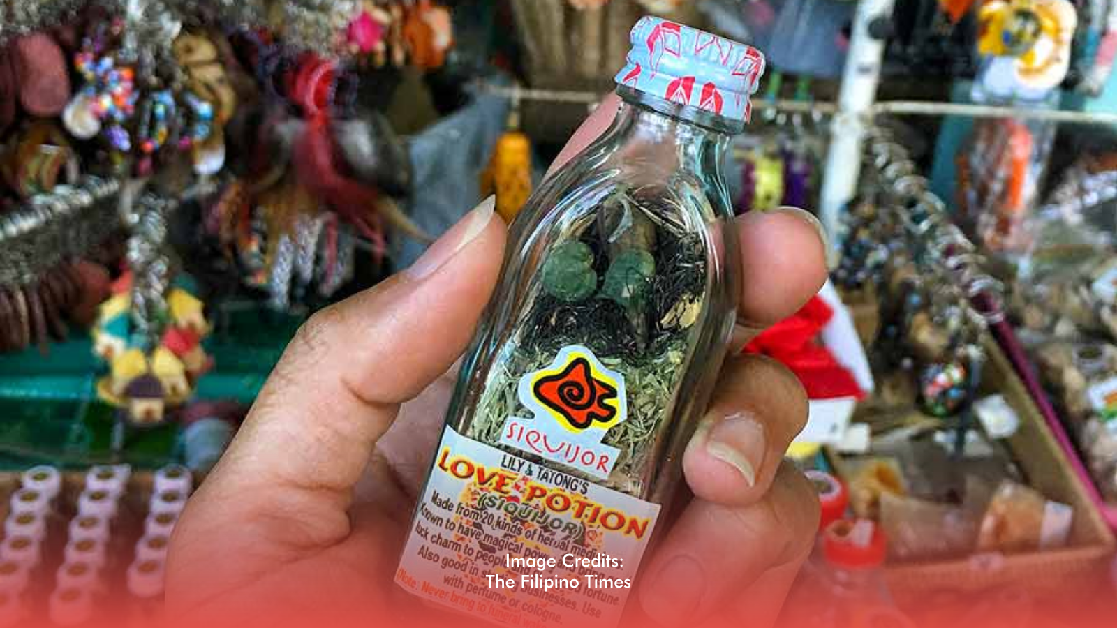 Small love potion bottles displayed at a Quiapo or Baclaran market stall.